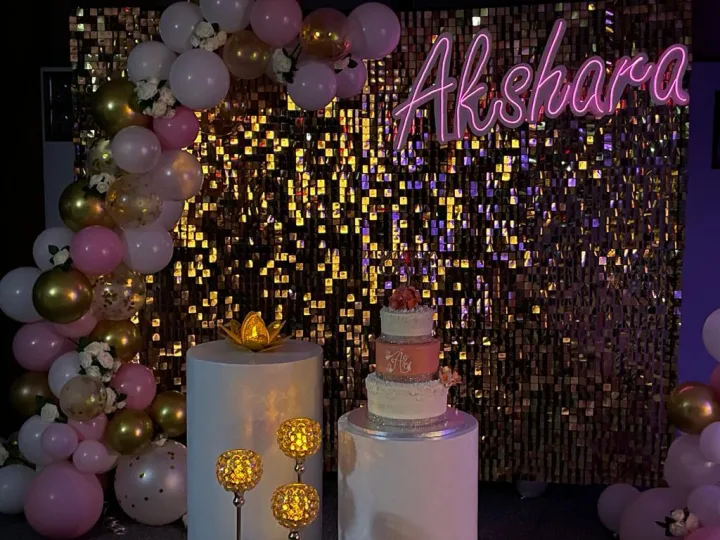 Sequin backdrop and balloon arch for a naming ceremony — event by Plan With YOLO, Pune