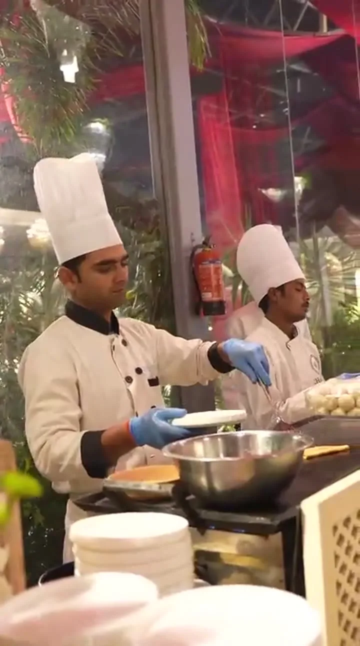 Two chefs on the live counter — event by Plan With YOLO, Pune