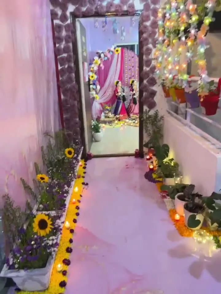 Flower-lined passage to the festival setup — event by Plan With YOLO, Pune