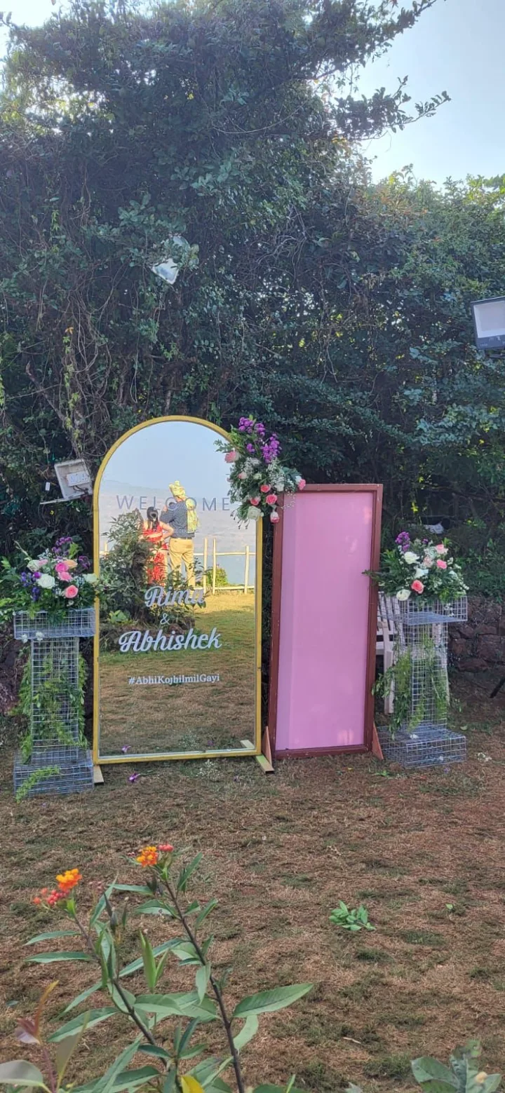Signage and florals at the gate — event by Plan With YOLO, Pune