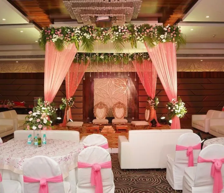 Pink drapes framing the mandap — event by Plan With YOLO, Pune