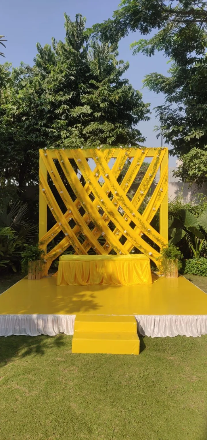 Geometric haldi stage in yellow — event by Plan With YOLO, Pune