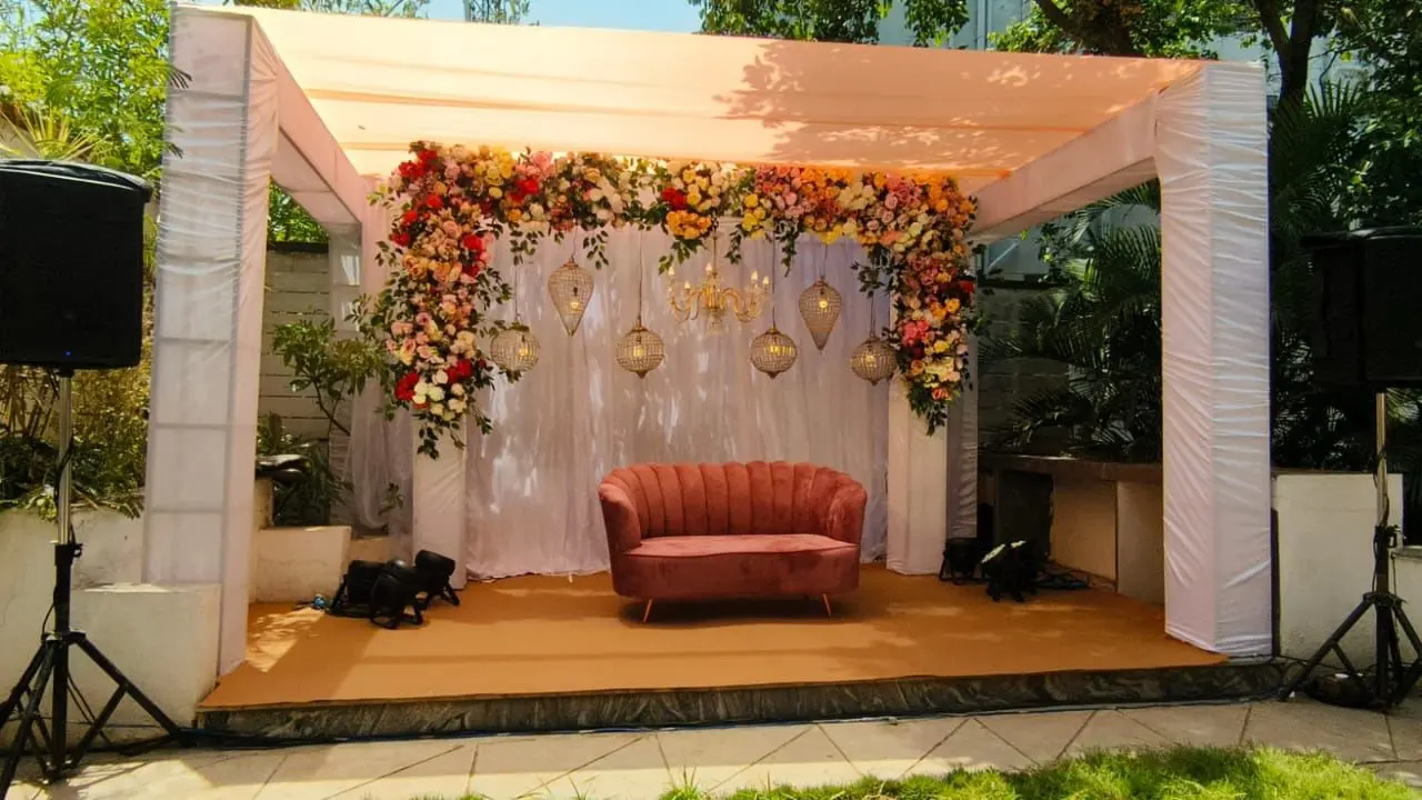 Floral stage backdrop reception — event by Plan With YOLO, Pune