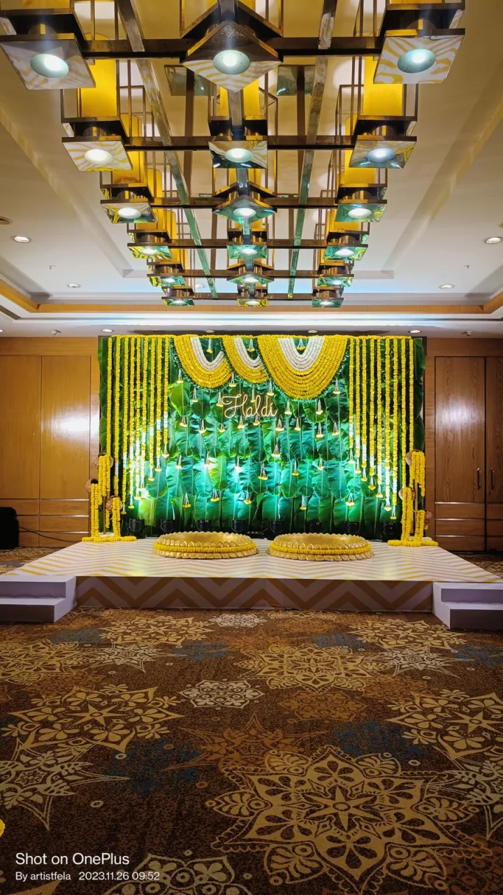 Marigold and green backdrop for a festival setup — event by Plan With YOLO, Pune