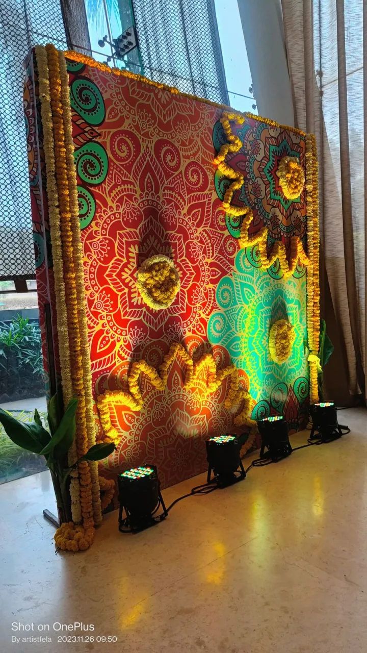 Hand-painted backdrop for a festival setup — event by Plan With YOLO, Pune