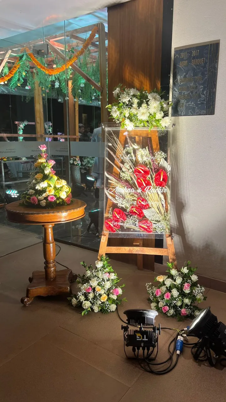 Ganesh setup at home, flowers and brass — event by Plan With YOLO, Pune