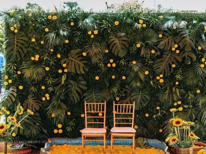 Haldi photobooth green wall — event by Plan With YOLO, Pune