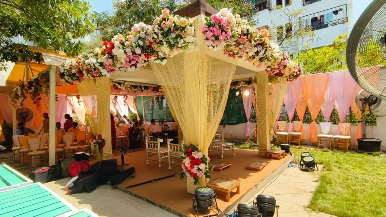 Floral mandap set in a garden — event by Plan With YOLO, Pune