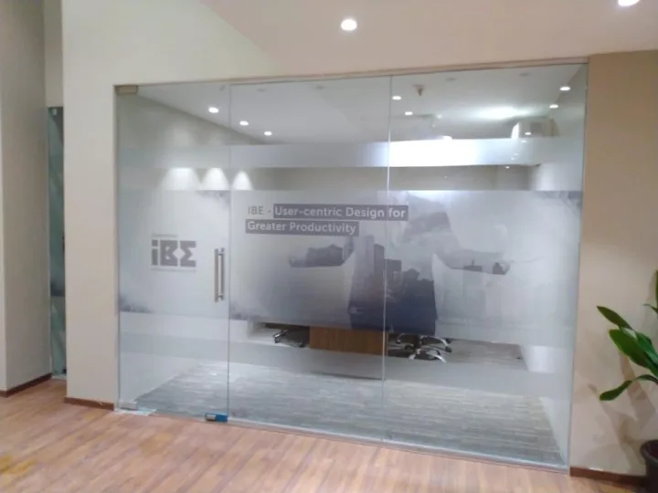 Frosted graphics across a meeting room front — event by Plan With YOLO, Pune