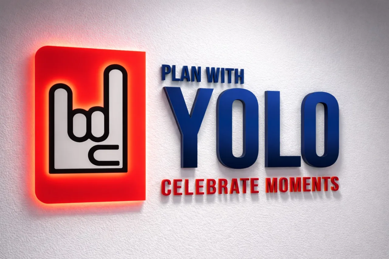 The signage lit from behind after dark — event by Plan With YOLO, Pune